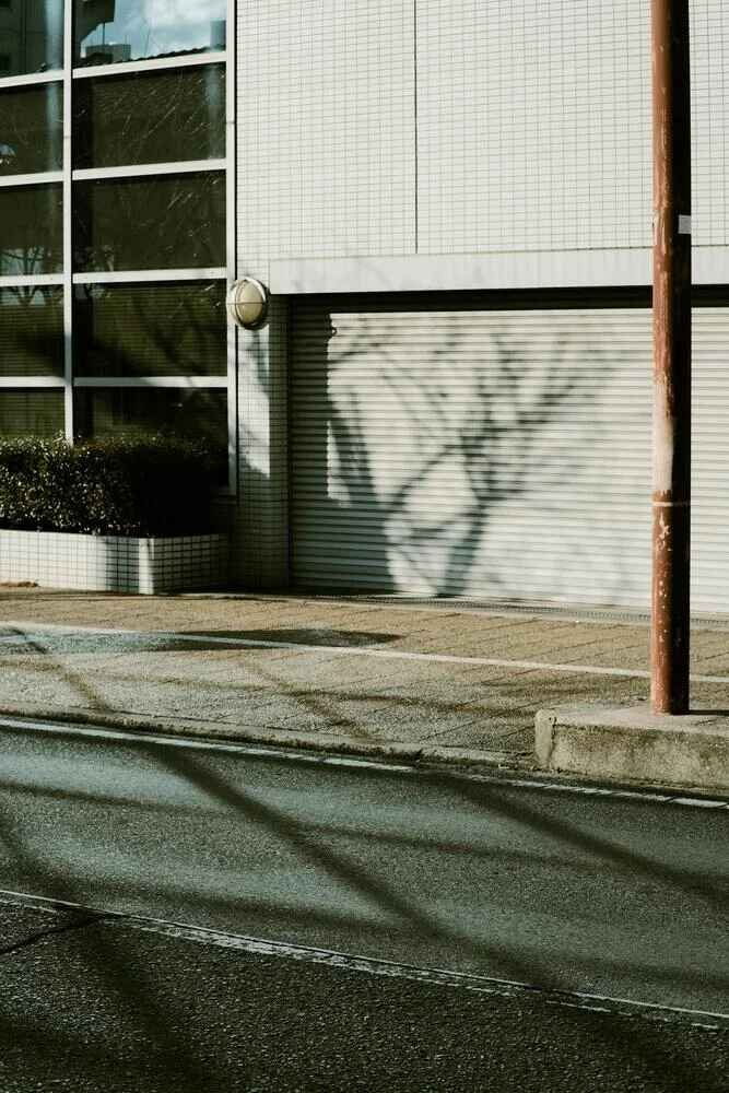 Technician performing garage door repair in Perth home